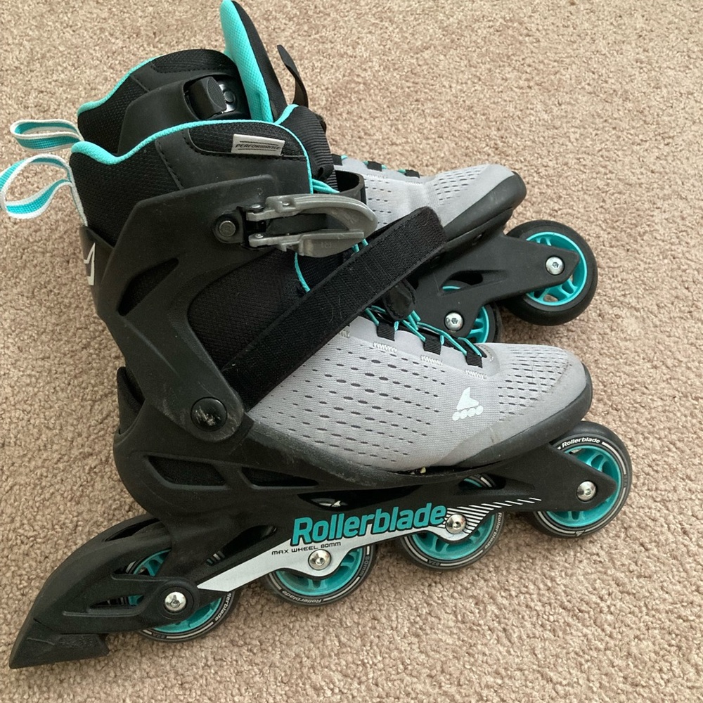 Teal roller blades with matching helmet